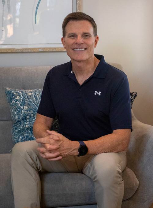 Dr. Daniel Carlow seated in the office